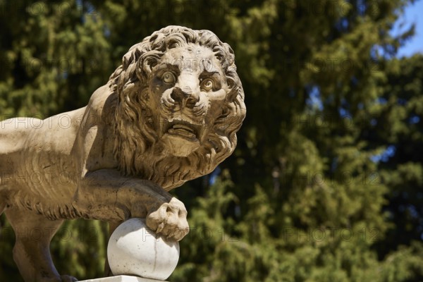 Detailed view of a lion statue with forest in the background, Rodini Park, City Park, Rhodes Town, Rhodes, Dodecanese, Greek Islands, Greece