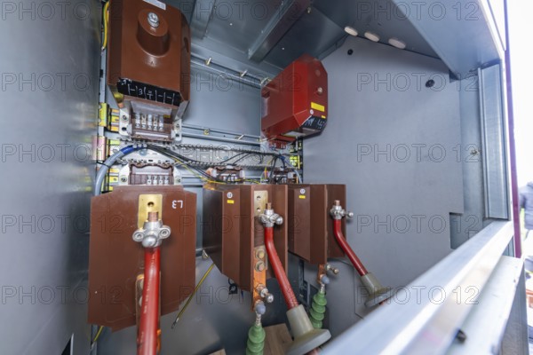View into an open switch box with visible electrical components and cabling, switch cabinet construction, PV system construction, major customers, Enzkreis, Germany
