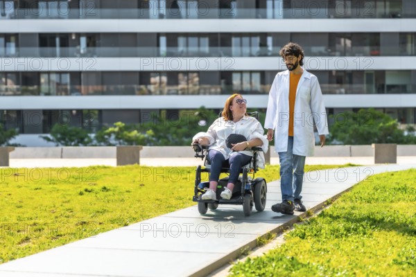 Doctor assisting a female patient in an electric wheelchair, strolling through a sunny park near the hospital, promoting rehabilitation and well being
