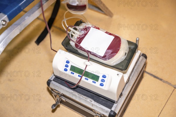 Top view of a scale weighing the bag of blood extracted from a donor with no people around