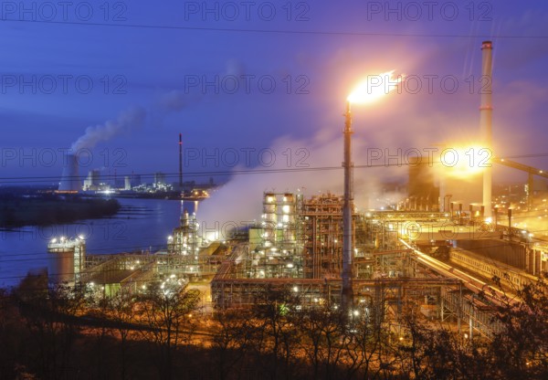 Duisburg, Ruhr area, North Rhine-Westphalia, Germany - ThyssenKrupp Steel, Schwelgern coking plant on the Rhine in Duisburg Marxloh, behind Walsum coal-fired power station