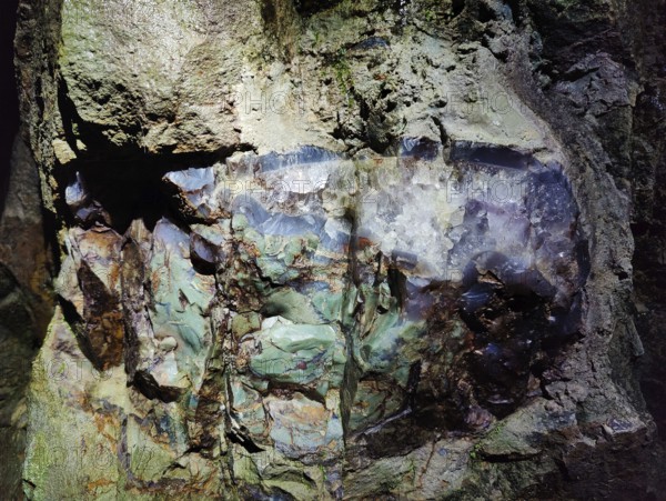 Green jasper with rock crystal in the visitor gallery of the Steinkaulenberg gemstone mines, Idar-Oberstein, Rheinpland-Pfalz, Germany
