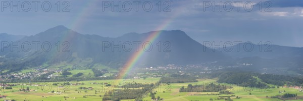 Panorama from the Grünten over the Illertal with rainbow to Blaichach and Immenstadt, behind Steineberg, 1660m and Mittagberg, 1451m, Allgäu Alps, Allgäu, Bavaria, Germany