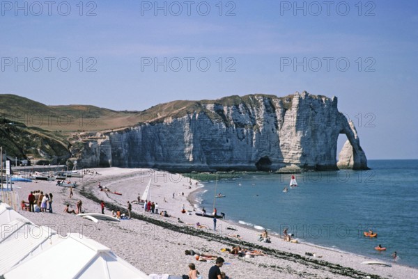 Chalk cliffs and sandy beach view to Falaise d'Aval, Etretat beach, Normandy, France 1976