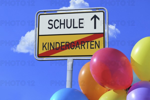 (Photomontage) Town exit sign with the lettering KINDERGARTEN/SCHULE