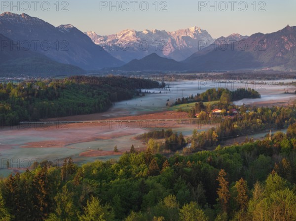 Aerial view, trees, forest, light green leaves, morning light, fog, mountains, sunny, spring, near Murnau, behind Zugspitze, Alpine foothills, Bavaria, Germany