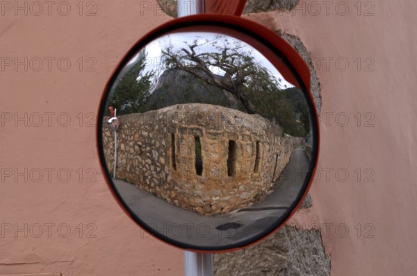 Reflection of a wall in a wide-angle mirror, traffic mirror 180 degrees, Alaró, Calvià, Majorca, Balearic Islands, Balearic Islands, Spain