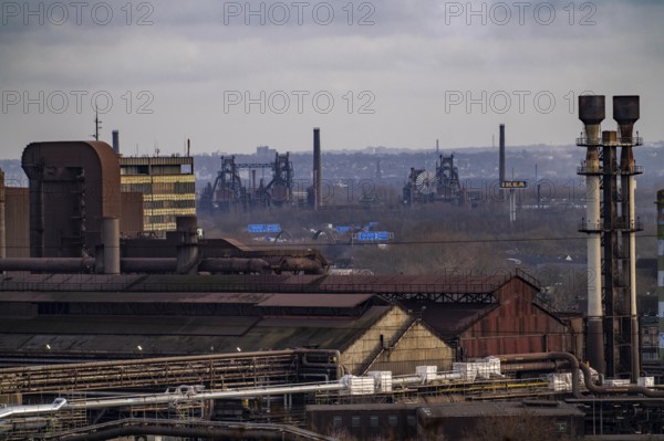 Panorama of the Thyssenkrupp Steel steelworks in Duisburg-Bruckhausen, oxygen steelworks and slab lines, in the background the former Thyssen steelworks Meidrich, today the Duisburg-Nord Landscape Park, blast furnaces, North Rhine-Westphalia, Germany