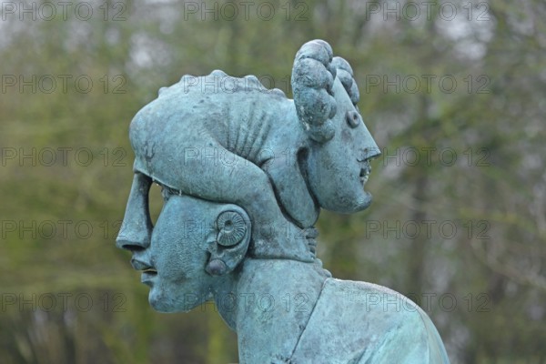 Sculpture Resonance by Jürgen Goertz 2017, head with two faces, double head, bronze sculpture, verdigris, bizarre, whimsical, modern art, abstract art, heads, nose, ear, shell, hole, front, back, on top of each other, front, back, direction, directions, both, detail, sculpture park, Wettersbach, Palmbach, Grünwettersbach, Karlsruhe, Baden-Württemberg, Germany
