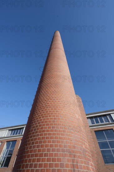 Former factory chimney in a new housing estate, Spardorf, Middle Franconia, Bavaria, Germany