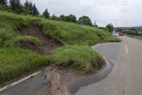 Symbolic image of climate change, slippery slope on a country road after heavy rainfall, near Berglen Hößlinswart, Baden-Württemberg, Germany