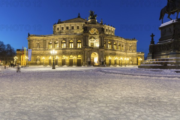 Illuminated Semper Opera House and Theatre Square with snow at dusk, Old Town of Dresden, Saxony, Germany