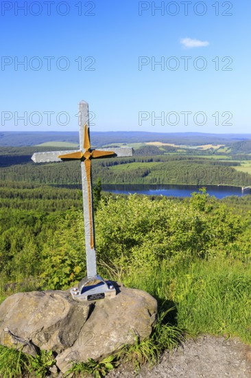 Small summit cross on the Bärenstein with a view of the Cranzahl dam, Erzgebirge, Saxony, Germany