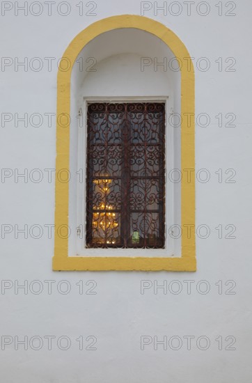 Mountain village Lakkoi with Agios Antonios church, church window, Crete, Greece