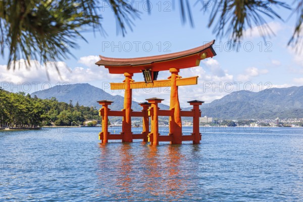 Famous red wooden torii gate UNESCO World Heritage Site on the island of Miyajima, Japan