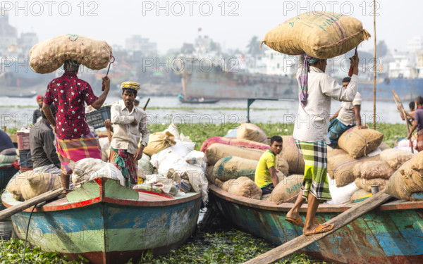 Workers with sacks on their heads, Dhaka, Bangladesh