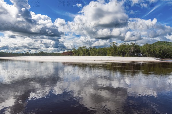 White sand beach before the granite hills of Cerros de Mavecure, Eastern Colombia