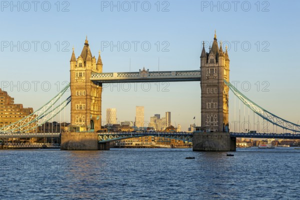 Tower Bridge in sunshine at dusk, River Thames from Southwark, London, England, UK