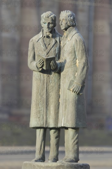 Brothers Grimm Monument, Jacob Grimm, Wilhelm Grimm, Brothers, bronze sculpture, two male figures standing with book in hand, reading, literature, Brothers Grimm Square, Kassel, Hesse, Germany