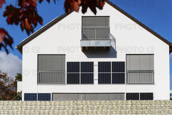 Solar panels on the wall of a detached house in Aachen, Germany