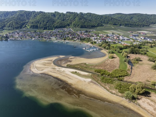 Aerial view of the mouth of the Stockacher Aach at low water, which flows into Lake Überlingen. The sedimentation of the suspended matter and sediment carried by the tributary is gradually silting up the shore zone near Bodman-Ludwigshafen. Lake Constance, district of Constance, Baden-Württemberg, Germany