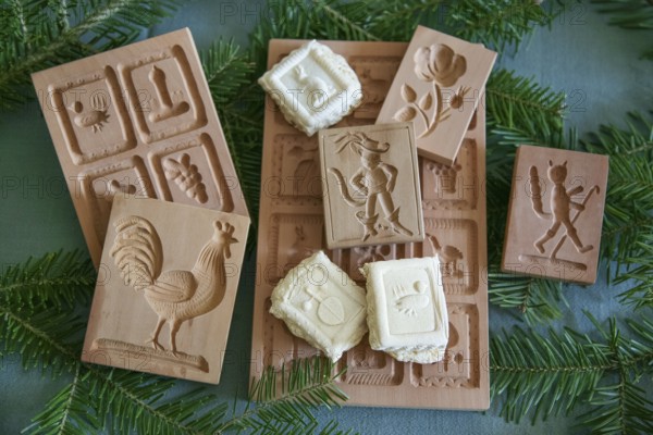 Swabian cuisine, Swabian Christmas biscuits, wooden moulds for making Springerle, model for shaping dough, traditional craftsmanship, typical Swabian, baking, Christmas bakery, sweet biscuits, Gutsle, Bredle, baked goods, from the oven, traditional cuisine, food photography, studio, Germany