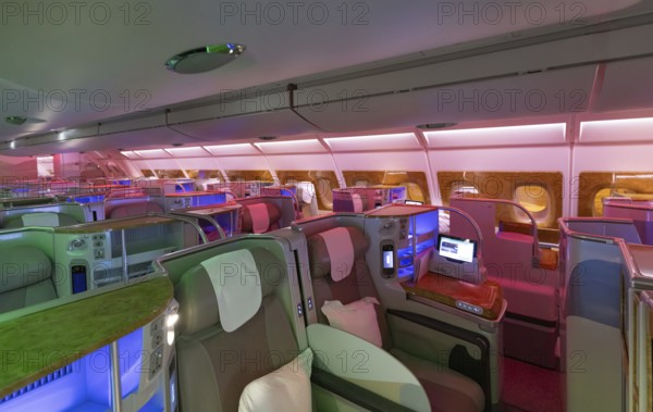 Modern airplane interiors, luxury first class and business class seats with entertainment area .