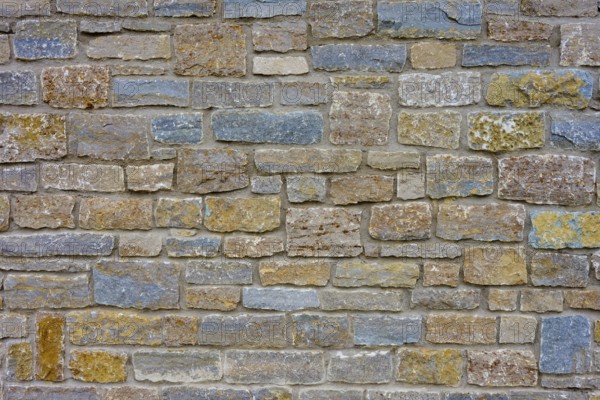 Natural stone wall with blue, grey discolouration and varied structure, Würzburg, Bavaria, Germany