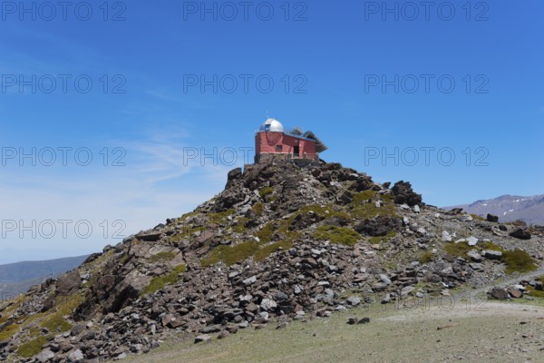 Red observatory building on a rocky hill under a blue sky, Obversatorium, Mohon del Trigo Observatorio, Observatorio del Mojón del Trigo, Güéjar Sierra, Güejar, Sierra Nevada, Andalusia, Spain