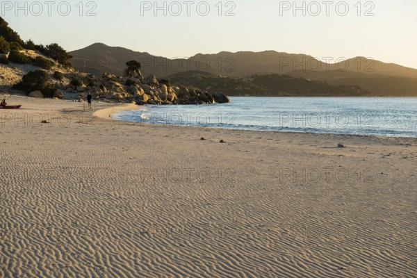 Lonely beach and rocks, sunrise, Spiaggia di Porto Giunco, Villasimius, south coast, Sardinia, Italy