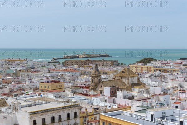 View of the Castillo de San Sebastian, from the Torre Tavira tower over the historic centre of Cádiz, Spain