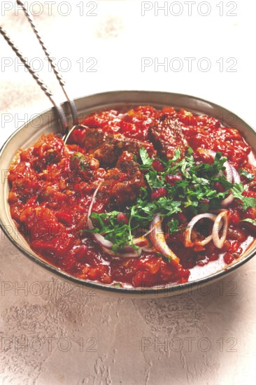 Chashushuli, a traditional Georgian dish, spicy, stewed meat with tomatoes and spices, homemade, no people