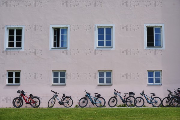 House facade, windows, bicycles, Ossiach Abbey, Ossiach, Lake Ossiach, Carinthia, Austria