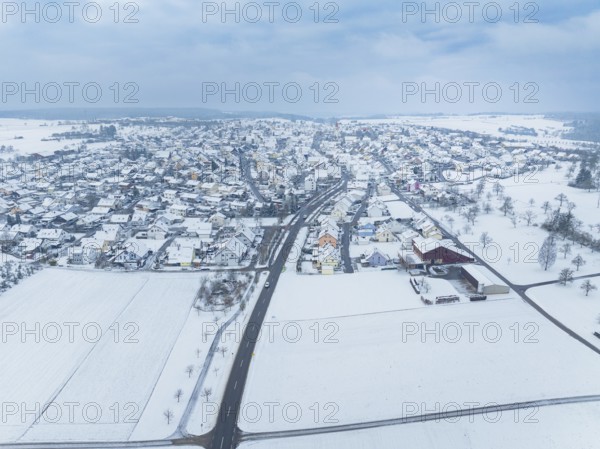Winter landscape with snow-covered town and surrounding fields, Deckenpfronn, Böblingen district, Germany
