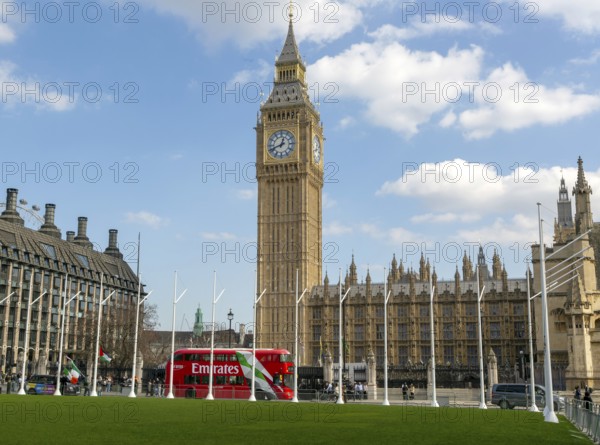 Big Ben, Houses of Parliament, Westminster, London, England, UK from Parliament Square Garden red double decker bus passing