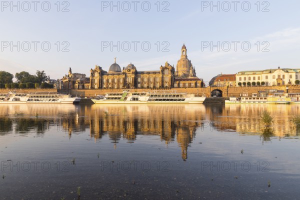Silhouette of the Old Town with reflection in the Elbe in the morning, steamboats on the Terrassenufer, Brühl's Terrace, Academy of Fine Arts and Church of Our Lady, Dresden, Saxony, Germany