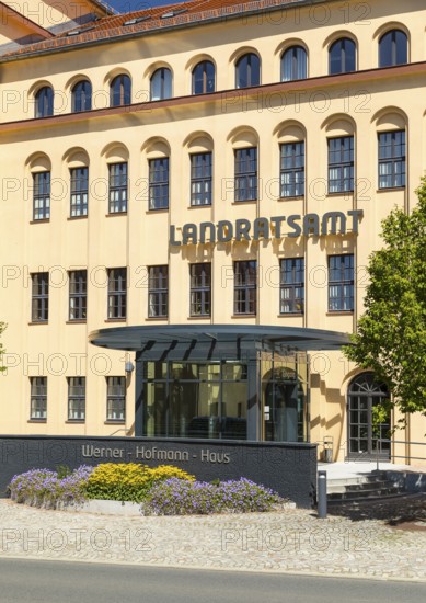Former porcelain factory, today district administration office, entrance area with lettering Werner-Hofmann-Haus, Freiberg, Saxony, Germany