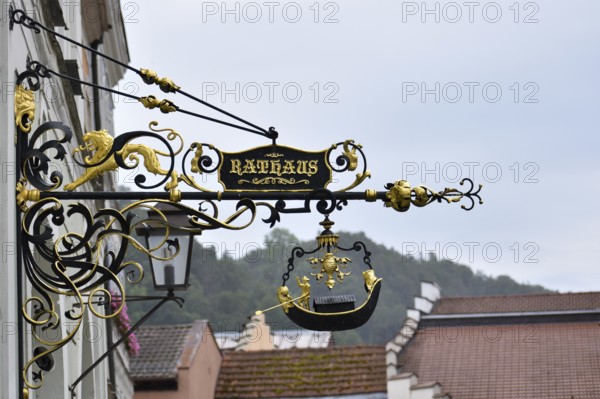 Historical sign with the inscription Rathaus in the old town centre of Burghausen, Bavaria, Germany