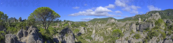 Panorama of the rock labyrinth and view of the village of Mourèze, Département Hérault, France