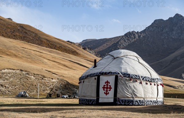 Yurts with yellow hills, Atbashy district in the Naryn region, Kyrgyzstan