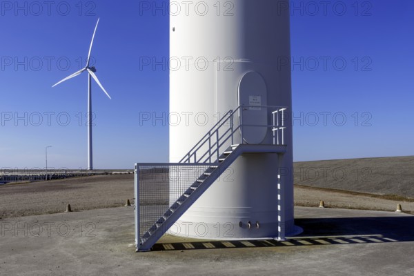 Entrance door to wind turbine tower at wind park, windfarm at Neeltje Jans, Eastern Scheldt storm surge barrier in Zeeland, Netherlands