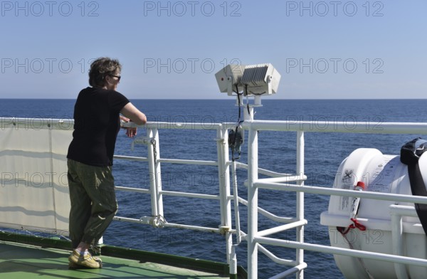 Woman travelling by sea to Heligoland, Schleswig-Holstein, Germany