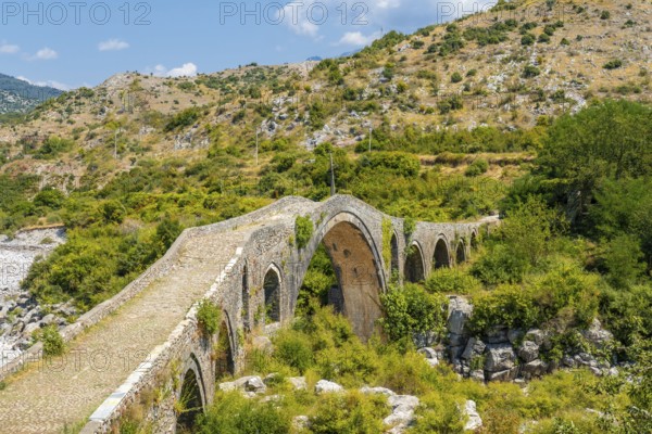 Aerial view of the Old Mes bridge near Shkoder. Albania, Europe. Ottoman stone arch bridge Ura e Kadiut