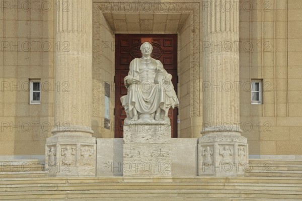 Johann Wolfgang von Goethe sitting on a throne, stone sculpture, monument, ruler, exalted, victor, triumphant, columns with fluting, Landesmuseum, city centre, Wiesbaden, Taunus, Hesse, Germany