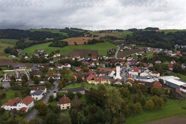 Drone shot, view of village with church, Enzenkirchen, Innviertel, Upper Austria, Austria