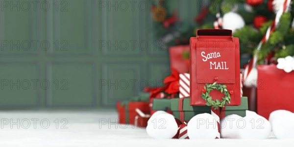 Christmas banner with red santa mail box in front of tree with green background with copy space