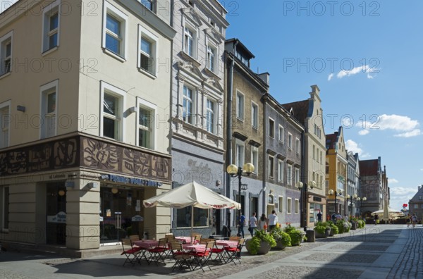 Charming old buildings along a quiet, sunny pedestrianised street with cafés, Old Town, Olsztyn, Alleinstein, Warmia-Masuria, Poland