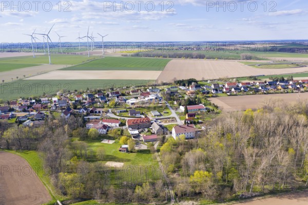 Aerial view of Grubnitz, in the background the village of Mautitz and wind turbines, Stauchitz, Saxony, Germany