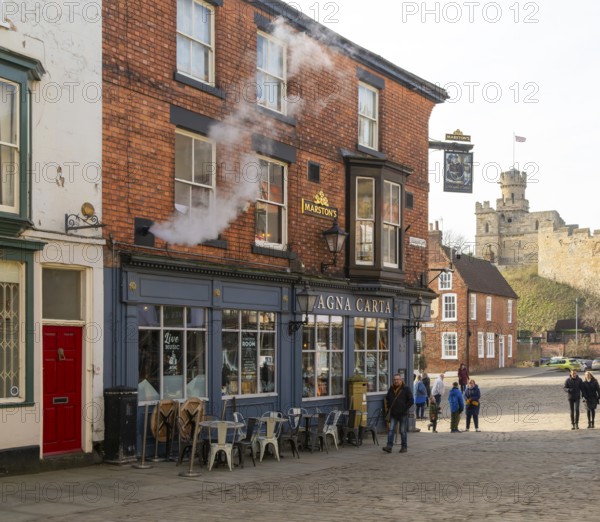 Magna Carta pub on Castle Hill, city of Lincoln, Lincolnshire, England, UK view to Observatory Tower of castle