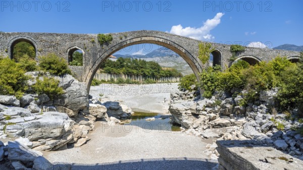 Aerial view of the Old Mes bridge near Shkoder from above. Albania, Europe. Ottoman stone arch bridge Ura e Kadiut